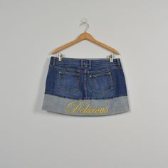 "denim two tone mini skirt, with fold detail, delicious embroidered. Condition: good! Some light wear on the buttons Brand: n:/a Color: medium wash (color is most accurate in flat lay images) Tag Size: 13 (please view measurements for accurate sizing) MEASUREMENTS: Waist (doubled): 35-36\" Hips (doubled): 41-42\" Length 12.75\" BEFORE PURCHASING PLEASE MAKE SURE TO MEASURE YOURSELF!  All pants are normally a little darker than the image because of the camera and studio lights. Please remember th Cheap Light Wash Denim Mini Skirt, Cheap Medium Wash Mini Skirt, Cheap Light Wash Mid-rise Mini Skirt, Affordable Light Wash Denim Mini Skirt, 90's Denim Mini Skirt, Affordable Denim Blue Mini Skirt For Fall, Affordable Trendy Medium Wash Mini Skirt, Cheap Mini Skirt With Pockets In Medium Wash, Cheap Denim Mini Skirt