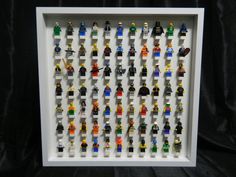 lego minifigure display in white frame on black background