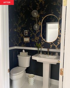 a white toilet sitting next to a sink in a bathroom under a large mirror above it