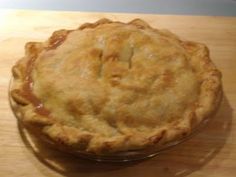 a pie sitting on top of a wooden table