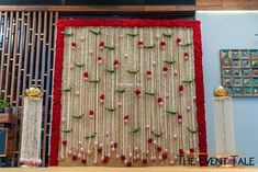 the wall is decorated with flowers and beads