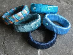 Free Shipping, Women's Gift, Stacking Rings, Blue Ring, Stackable Ring, Fabric Ring, Textile Ring, Fabric Jewelry, Textile Jewelry, bohemian jewelry rings.This listing is for one ring from my Satin Ring Series. It comes in beautiful shades of blue. Just choose your favorite color from the pictures and let me know in your "message to seller". This is a stackable ring that can be worn alone or together with other stackable rings.This satin covered ring comes with a Swarovski stone, in a beautiful Fabric Ring, Rings Blue, Feather Bracelet, Blue Ring, Swarovski Stones, Textile Jewelry, Blue Gems, Blue Jewelry, Stackable Ring