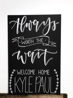 a sign that says, happys worth the word welcome home kyepaul