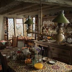 a dining room table with plates and cups on it