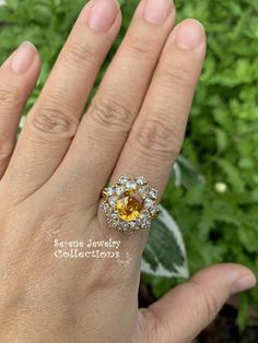 Thank you for coming in! This Vintage Ring has a strong striking yellow sapphire as its center piece. The sapphire is bezel set into a fancy setting with 8 heart and 8 round diamonds totaling 1.8 carats! Ring Size: 7.75 Total Weight: 9.58 grams Precious Metal: 18k solid gold Precious stones: -Yellow Sapphire: 2.92 carats, 9mm x 7.3mm -White Round Diamonds: 1.8 ct Hallmark: A18K Yellow Multi-stone Round Gemstones, Yellow Multi-stone Sapphire Ring, Yellow Sapphire Ring With Center Stone In Yellow Gold, Yellow Multi-stone Diamond Ring In Fine Jewelry Style, Yellow Multi-stone Diamond Ring Fine Jewelry, Elegant Multi-stone Yellow Sapphire Jewelry, Elegant Yellow Sapphire Multi-stone Jewelry, Yellow Multi-stone Diamond Ring, Fine Jewelry Yellow Multi-stone Diamond Ring