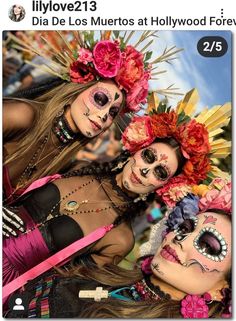 three women with face paint and flowers on their heads are posing for a photo together