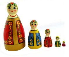 a group of wooden dolls sitting next to each other