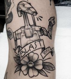 a black and white photo of a tattoo on someone's leg that says blast