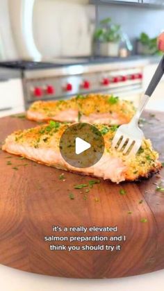 someone is using a fork to cut up some food on a cutting board in the kitchen