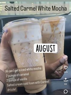 two cups of iced coffee sitting next to each other on a car dashboard with the caption, salted caramel white mocha