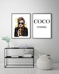 two posters with the words coco and chanel on them in front of a white wall