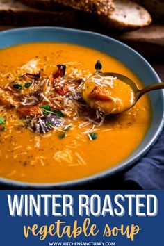 a bowl of winter roasted vegetable soup with bread in the background and text overlay