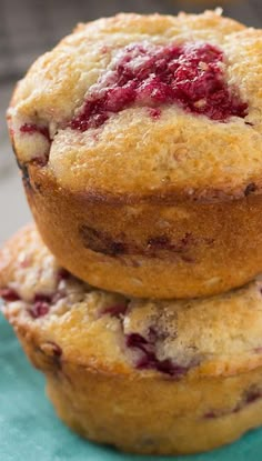 three blueberry muffins stacked on top of each other