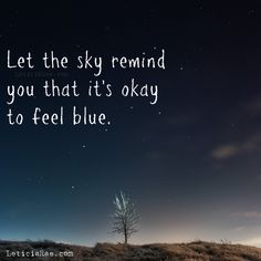 a lone tree in the middle of a field under a night sky