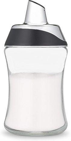 a glass jar with a black lid and silver trim on the top is shown in front of a white background