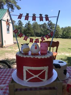 a birthday cake with farm animals on top