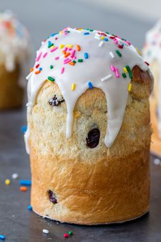 a bundt cake with white frosting and sprinkles