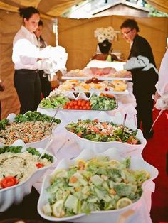 a buffet table with many different types of food on it