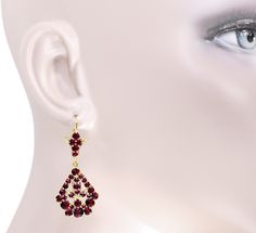 The perfect elegant finishing touch for your special ensembles, these rich Victorian bohemian garnet leaf drop earrings feature over 4 carats total of fiery red round rose cut natural bohemian garnets ( January Birthstone ) securely prong set in a two tier design in 14K yellow gold vermeil over sterling silver. A shimmering garnet leaf is set atop a precious wreath of sparkling garnets that increase in size as the eye moves toward the bottom of the wreath. The total effect created by this design Elegant Garnet Teardrop Earrings, Elegant Burgundy Earrings For Formal Occasions, Elegant Ruby Chandelier Dangle Earrings, Elegant Ruby Chandelier Earrings For Gift, Elegant Burgundy Dangle Jewelry, Red Garnet Earrings, Natural Bohemian, January Birthstone, Garnet Earrings