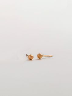 These tiny, little 3mm ball earrings are a classic look that still gives you a cool edge. Add them to your second hole to add a touch of gold to your layered look. Earring backs included. Sold as a pair. Earring back included. Metal: 14K Gold-FilledSize: 3mm Ball Earrings, Touch Of Gold, Layered Look, Earring Backs, Classic Looks, Gold Filled, Stud Earrings, Gold