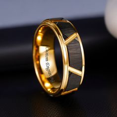 Discover elegance with our Men's Marriage Ring. Crafted in 18K gold-plated tungsten, it's personalized with custom name engraving. A timeless symbol of love and commitment, perfect for anniversaries or special occasions. Quality assurance guaranteed: Suitable for sensitive skin, ensures no green discoloration on your finger, remains untarnished and rust-free, and is safe for shower wear. Material: Superior Quality Tungsten Width: 0.8cm Package includes: 1 x ring + complementary jewelry gift box Wedding Band For Him, Engraving Ring, Wedding Bands For Him, X Ring, Marriage Ring, Tungsten Wedding Band, Timeless Symbol, Tungsten Wedding Bands, Love Symbols