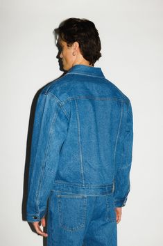 A classic denim trucker jacket inspired by off-duty model uniforms in the 90's. With a straight, boxy cut and a slight crop and taper into the waist, the silhouette is effortless, rugged and boyish. An everyday layer for the California cowboy. Pair with the matching Rodeo Classic Straight-leg Jeans for the ultimate Canadian tuxedo. California Cowboy, Canadian Tuxedo, Fitted Denim Jacket, Denim Trucker Jacket, Trucker Jacket, Off Duty, Rodeo, Cotton Twill, Straight Leg Jeans