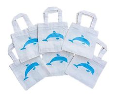 five white bags with blue dolphins on them