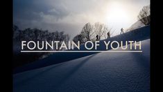 the words fountain of youth on top of a snow covered hill with trees in the background