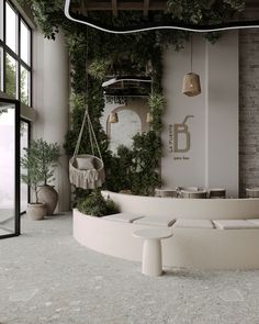 the interior of a restaurant with plants on the wall