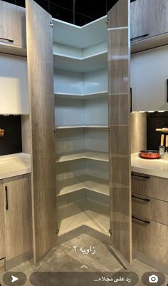 an empty walk - in closet is shown with the door open to reveal it's shelves