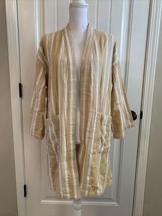 New Eileen Fisher Striped Organic Cotton Doubleweave Kimono Jacket Reed mustard yellow and cream white Size XXS/XS TTP/TP SIZE & FIT Easy fit About 35.5" from shoulder to hem Model shown is 5'10" (177cm) wearing US size Small Details: Signature kimono silhouette updated in jaunty stripes. Open front Dropped shoulders Three-quarter sleeves Waist patch pockets Organic cotton Machine wash Imported Comes from smoke and pet free home. Spring Long Sleeve Cardigan With Patch Pockets, Casual Spring Cardigan With Patch Pockets, Cream Linen Long Sleeve Outerwear, Casual Cream Linen Outerwear, Fall Linen Loungewear Outerwear, Fall Linen Outerwear For Loungewear, Kimono Jacket, Eileen Fisher, Three Quarter Sleeves