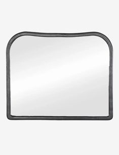 a black metal frame mirror on a white wall with an empty space in the middle