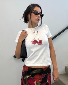 Add some sweet style to your wardrobe with our Mon Cheri Cherry Baby Tee! This trendy fruit crop top features a bold red cherries graphic, perfect for the downtown girl with a love for Y2K fashion. SIZING -This is a "youth" Gildan 5000B t shirt -Please review the size chart to ensure you order the correct size -These shirts reflect the vintage 90's baby tee fit and hit at hip length. They may fit looser around the waist and are not designed to be skin tight.  -We recommend measuring against a shirt you already own & love to get the perfect fit! DETAILS -100% cotton, Sports Grey color is 90% cotton 10% polyester -Tear away label -Machine wash cold with like colors and tumble dry on low heat, due to the cotton nature garments may shrink with first wash SHIPPING & RETURNS -Items are made to o Cherry Top Outfit, Cherry Baby, Shirt Y2k, Label Machine, Downtown Girl, Fit Details, Cherry Bomb, Mon Cheri, 90s 2000s