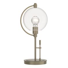 a light that is on top of a metal stand with a glass ball in the middle