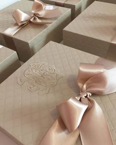 several boxes with satin ribbons tied around them