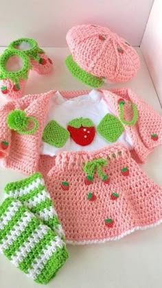 a crocheted baby outfit and booties is shown