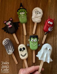 there are many halloween treats on the sticks