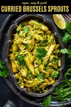 an overhead view of a bowl of curried brussels sprouts with cilantro and parsley