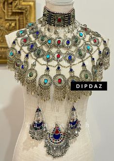 Explore the timeless beauty and intricate craftsmanship of our Afghan ethnic jewelry collection at Dipdaz. Each piece in our collection is a unique work of art, meticulously handcrafted by skilled artisans using traditional techniques passed down through generations. Our jewelry features a stunning array of vibrant gemstones, intricate metalwork, and authentic tribal designs, making every piece a true statement of cultural heritage and elegance. From bold necklaces adorned with colorful stones t Ceremonial Multicolor Metal Jewelry, Multicolor Tilla Jewelry For Gifts, Bohemian Hand Set Jewelry For Ceremonial Occasions, Elegant Multicolor Ceremonial Jewelry, Artisan Handmade Festive Jewelry, Traditional Decorative Wedding Jewelry, Multicolor Unique Jewelry For Ceremonial Occasions, Traditional Pendant Jewelry For Jewelry Making, Bohemian Jewelry Sets With Intricate Design For Wedding