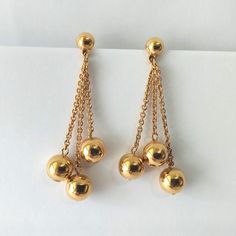 Vintage gold plated chain drop bead pierced earrings. Great condition with shiny polish. No markings. Size: 1 7/8" x 5/8"   Thank you for visiting our shop! Please refer to photos as part of the description. Please Check out FAQs and Shop Policies and our other items  on our home page at https://vintagebytiffinie.etsy.com SHIPPING: We combine shipping if your items can be packed safely together.  All purchases over $100.00 ships with signature confirmation.  Please contact us with any further qu Formal Long Drop Earrings With Dangling Beads, Formal Long Drop Dangling Beads Earrings, Gold-tone Dangle Chandelier Earrings For Formal Occasions, Gold Chandelier Earrings With Gold Beads, Gold Chandelier Dangle Earrings With Beads, Gold Dangle Chandelier Earrings With Beads, Gold Beaded Long Drop Earrings, Yellow Gold Long Drop Earrings With Dangling Beads, Gold Beaded Drop Earrings