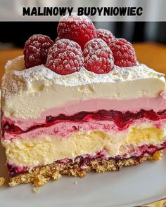 there is a piece of cake with raspberries on it and the words malnowy budynowiec above it