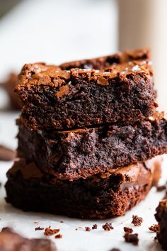 a piece of chocolate cake sitting on top of a white plate