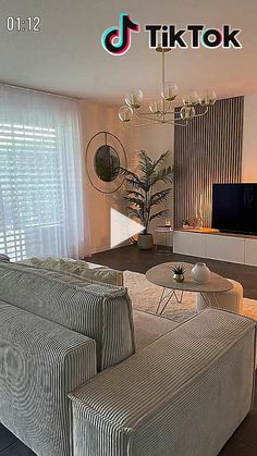 a living room filled with furniture and a flat screen tv