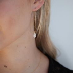 Fresh and clean these milky white moonstones look beautiful with gold and silver. They're so easy to wear because they go with everything, we mean it. These threaders have a "U" where they hang on your ears for added security. Details: Gemstone: 12x5mm Earring length in the front: 2 inches Earring length in the back: 1.25 inches Sterling Silver or 14k Gold Filled Please note the silver earrings come on a box chain and the gold come on a cable chain earring. Need help layering? Go here for some i Threader Earrings Gold, Chain Earring, White Moonstone, Hypoallergenic Jewelry, Milky White, Threader Earrings, Mean It, Fresh And Clean, Chain Earrings