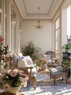 the sun shines through the windows into an elegant living room with blue and white decor