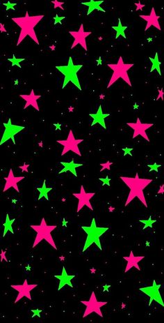 green and pink stars on a black background