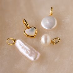 Minimalist White Jewelry With Charms, Minimalist Wedding Charm Necklaces, Minimalist White Charm Necklaces, White Minimalist Charm Necklace, Minimalist White Charm Necklace, Minimalist Charms With Lobster Clasp, Elegant Pearl Charm For Everyday, Everyday Jewelry With Round Charms And Beads, Elegant Pearl Charm