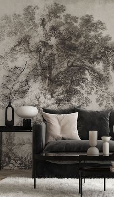 a black and white photo of a living room with wallpapers on the walls