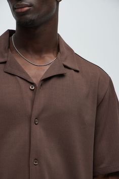 Available In Brown, White and Sage Fold Down Collar Front Button Closure Textured Detail Short Sleeve 95% Polyester, 5% Spandex Imported | Mens Koa Textured Shirt in Brown size 3XL by Fashion Nova Brown Collared Top With Button Closure, Brown Collared Top With Placket, Casual Brown Top With Johnny Collar, Classic Brown Tops With Johnny Collar, Casual Brown Johnny Collar Top, Classic Brown Top With Johnny Collar, Brown Relaxed Fit Top With Placket, Brown Spread Collar Top With Button Closure, Brown Camp Collar Top With Button Closure