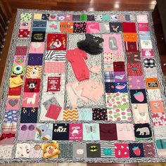 there is a quilt that has many different items on it